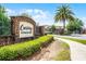 Entrance to Crossing at Emerson Park with manicured bushes, brick sign and secure gated entry at 1109 Pavia Dr, Apopka, FL 32703