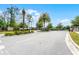 Community entrance features manicured landscaping, signage, and controlled gated access for residents at 1109 Pavia Dr, Apopka, FL 32703