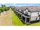 Aerial view showcases an exterior of townhomes, with well-maintained landscaping at 1109 Pavia Dr, Apopka, FL 32703