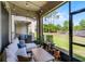 Relaxing screened-in patio with comfortable seating and string lights at 1109 Pavia Dr, Apopka, FL 32703