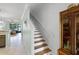 The home's staircase has wood treads and white risers, leading to the upper level at 1109 Pavia Dr, Apopka, FL 32703