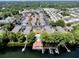 Aerial view featuring lake access, pool, dock and waterfront pavilion at 1163 Paseo Del Mar # B, Casselberry, FL 32707
