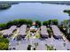 Beautiful aerial view of condo buildings and community pool on the lake at 1163 Paseo Del Mar # B, Casselberry, FL 32707