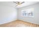 Bedroom features wood-look flooring, neutral walls, and a ceiling fan at 1163 Paseo Del Mar # B, Casselberry, FL 32707