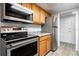 Updated kitchen features stainless steel appliances and granite countertops at 1163 Paseo Del Mar # B, Casselberry, FL 32707