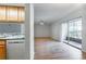 Spacious living room featuring new flooring and a sliding glass door at 1163 Paseo Del Mar # B, Casselberry, FL 32707