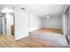 Large living room with new flooring, ceiling fan, and a sliding glass door at 1163 Paseo Del Mar # B, Casselberry, FL 32707