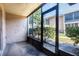 Outdoor patio featuring a concrete floor and screened windows at 1163 Paseo Del Mar # B, Casselberry, FL 32707