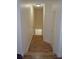 Hallway leading to the floor below featuring hardwood floors and natural light at 12212 Wild Iris Way # 106, Orlando, FL 32837