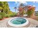 Relaxing hot tub surrounded by lush landscaping and a serene atmosphere at 12212 Wild Iris Way # 106, Orlando, FL 32837
