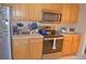 Well-equipped kitchen with stainless steel appliances and ample counter space at 12212 Wild Iris Way # 106, Orlando, FL 32837