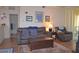 Cozy living room with hardwood floors, neutral walls, and balcony access at 12212 Wild Iris Way # 106, Orlando, FL 32837