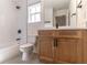 Bathroom featuring a tub, shower, wood cabinet and black hardware at 1321 Weber St, Orlando, FL 32803