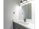 Modern bathroom featuring gray vanity and black fixtures at 1321 Weber St, Orlando, FL 32803