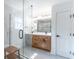 Bathroom featuring glass shower and dual vanities at 1321 Weber St, Orlando, FL 32803