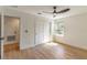 Spacious bedroom featuring wood floors, a modern ceiling fan, closet, and natural light at 1321 Weber St, Orlando, FL 32803