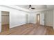 Large bedroom with wood floors and multiple doors at 1321 Weber St, Orlando, FL 32803