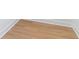 Detailed view of hardwood flooring with white trim at 1321 Weber St, Orlando, FL 32803
