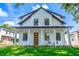 Charming two-story home featuring a covered front porch and well-maintained landscaping at 1321 Weber St, Orlando, FL 32803