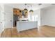 Modern kitchen featuring an island with pendant lighting, wood cabinets, and stainless steel appliances at 1321 Weber St, Orlando, FL 32803