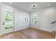 Cozy room with hardwood floors, natural light, and a modern ceiling fixture at 1321 Weber St, Orlando, FL 32803