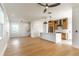 Spacious open-concept area with kitchen and dining with hardwood floors and great lighting at 1321 Weber St, Orlando, FL 32803