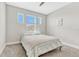 Bright bedroom featuring three windows and neutral carpet at 13347 Gabor Ave, Orlando, FL 32827