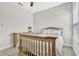 Simple ' bedroom with wood crib and light-colored dresser at 13347 Gabor Ave, Orlando, FL 32827