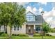Inviting exterior featuring a cozy porch swing, a 'welcome' sign, and lush green landscaping at 13347 Gabor Ave, Orlando, FL 32827