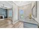 Foyer featuring hardwood floors, a console table with decor, and an open view into the living room at 13347 Gabor Ave, Orlando, FL 32827