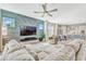 Open floor plan living room featuring a modern design and seamless connection to the kitchen at 13347 Gabor Ave, Orlando, FL 32827