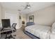 Bedroom with a bed, closet, and a computer desk, offering a cozy space at 13609 Sky Blue Ct, Orlando, FL 32828