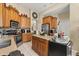 Well-equipped kitchen with wood cabinets, granite countertops, stainless steel appliances, and ample storage at 13609 Sky Blue Ct, Orlando, FL 32828