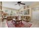 Spacious living room featuring large windows for natural light, comfortable seating, and neutral tones at 13609 Sky Blue Ct, Orlando, FL 32828