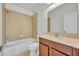 Bathroom featuring a shower-tub, wooden vanity with beige countertop and tiled flooring at 13913 Hahn Ln, Orlando, FL 32827