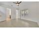 Bright bedroom with fan, and doorway view into the bathroom at 13913 Hahn Ln, Orlando, FL 32827