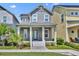 Charming two-story home featuring a welcoming front porch with classic columns and well-maintained landscaping at 13913 Hahn Ln, Orlando, FL 32827