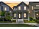 Charming two-story home at dusk featuring a welcoming front porch with classic columns and well-maintained landscaping at 13913 Hahn Ln, Orlando, FL 32827