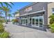 Exterior shot of community fitness center with glass doors, palm trees, and easy access for residents at 13913 Hahn Ln, Orlando, FL 32827