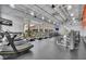 Spacious community gym boasts modern equipment, ample natural light, and a motivating environment for fitness enthusiasts at 13913 Hahn Ln, Orlando, FL 32827