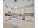 Beautiful kitchen with stainless steel appliances, stone backsplash, and central island at 13913 Hahn Ln, Orlando, FL 32827