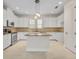 Modern kitchen with white cabinets, granite countertops, and stainless steel appliances at 13913 Hahn Ln, Orlando, FL 32827