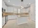 Well-lit kitchen features granite countertops, stainless appliances, and ample cabinet space at 13913 Hahn Ln, Orlando, FL 32827