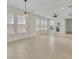 Spacious living room with modern ceiling fan and expansive windows, offering ample natural light at 13913 Hahn Ln, Orlando, FL 32827