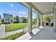 Open porch area offers a scenic view of the lawn and other houses in the neighborhood at 13913 Hahn Ln, Orlando, FL 32827