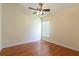 This bedroom offers a ceiling fan and a window with blinds to allow natural lighting at 14155 Portrush Dr, Orlando, FL 32828