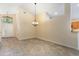 Bright dining room with tile floors and chandelier, adjacent to a doorway at 14155 Portrush Dr, Orlando, FL 32828