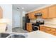Kitchen features stainless steel appliances, light cabinetry, and tiled floors at 14155 Portrush Dr, Orlando, FL 32828