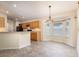 Bright kitchen features light wood cabinetry, stainless steel appliances, and a breakfast nook area at 14155 Portrush Dr, Orlando, FL 32828
