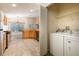 Open kitchen leads to breakfast nook, adjacent to laundry room for added convenience at 14155 Portrush Dr, Orlando, FL 32828
